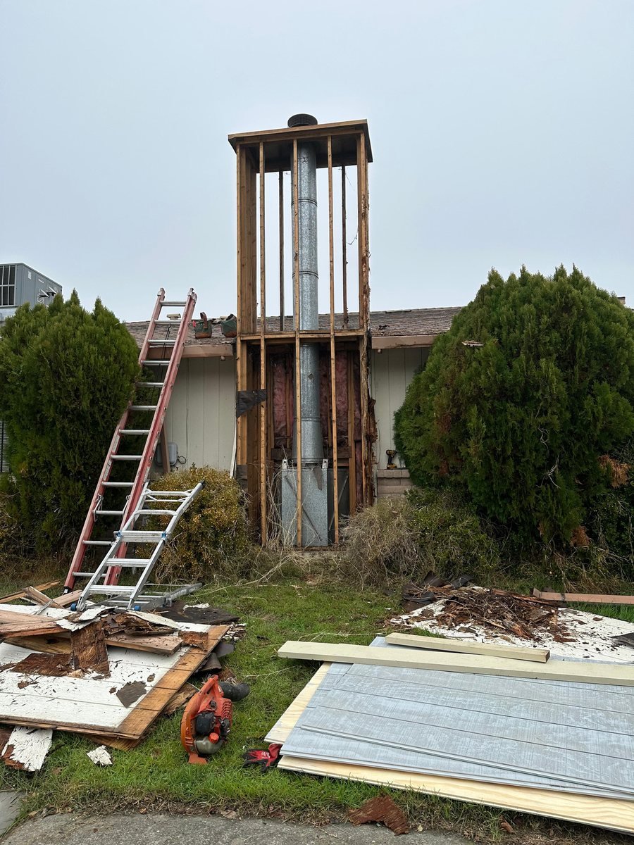 Failed chimney structure stripped back and prepared for a full rebuild