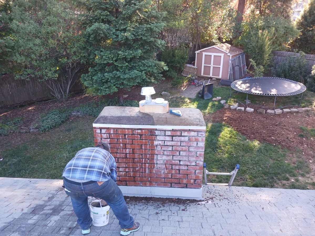 Brick chimney repointed and fitted with a new cap